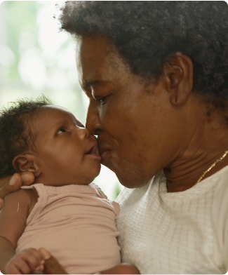 older adult and baby