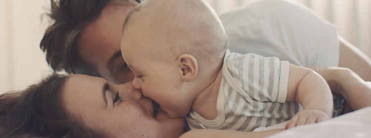 family interacting with baby