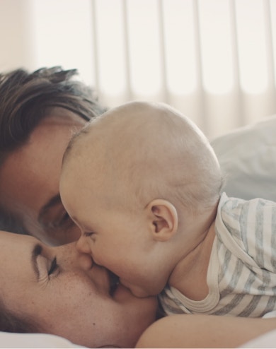 family interacting with baby